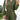 Front view of model wearing the One Way Ticket Romper, that features olive fabric, wood button closures, v neckline, two front pockets with tie details and balloon long sleeves with elastic wrists