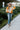 Full body view of model wearing the Autumn Skies Sweater which features light orange, bright orange and rust knit fabric, diagonal stripe pattern, round neckline with ribbed knit fabric and long ballon sleeves with ribbed knit fabric wrists.
