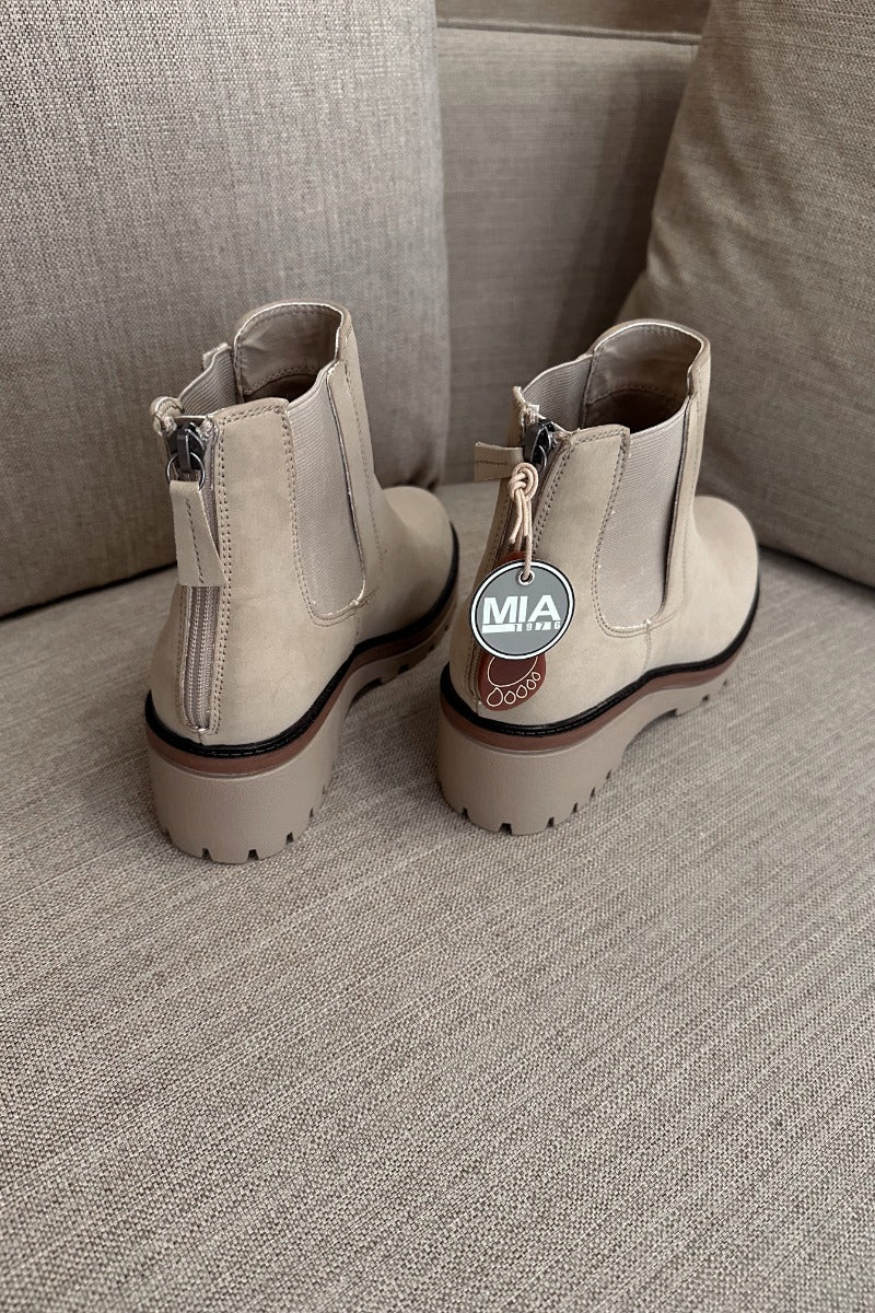 Back view of the Sefi Boot in Sand which features beige suede upper fabric, side elastic paneling, contoured footbed, rubber outsole and rounded toe.