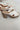 Side view of Farrah Platform Mules which features beige woven upper cross straps, slide entry, beige footbed and platform block heel.
