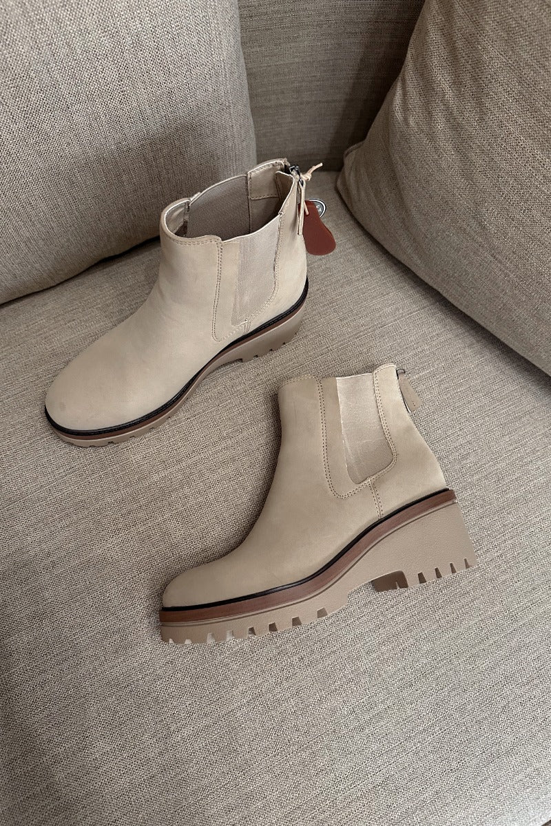 Front lay view of the Sefi Boot in Sand which features beige suede upper fabric, side elastic paneling, contoured footbed, rubber outsole and rounded toe.