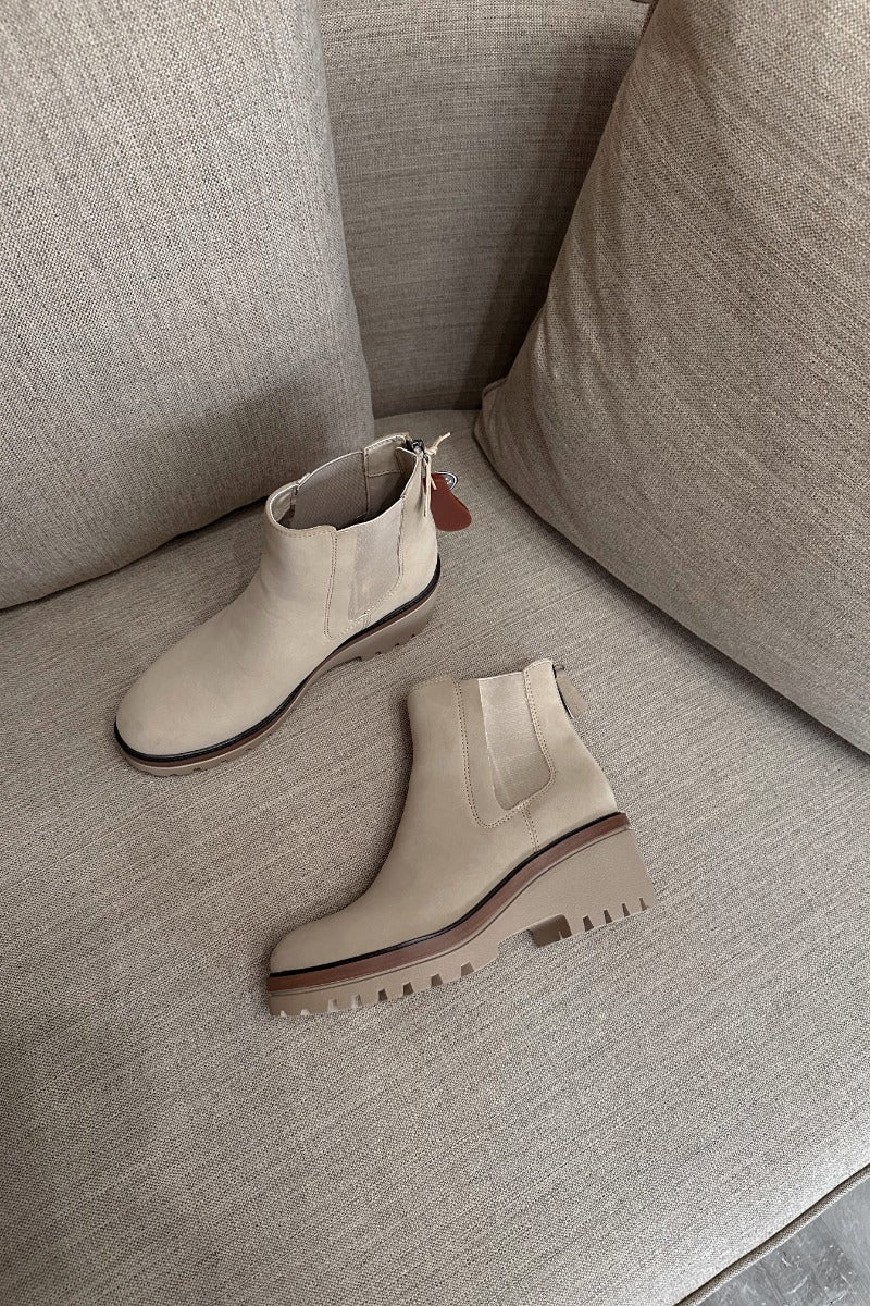 Front lay view of the Sefi Boot in Sand which features beige suede upper fabric, side elastic paneling, contoured footbed, rubber outsole and rounded toe.