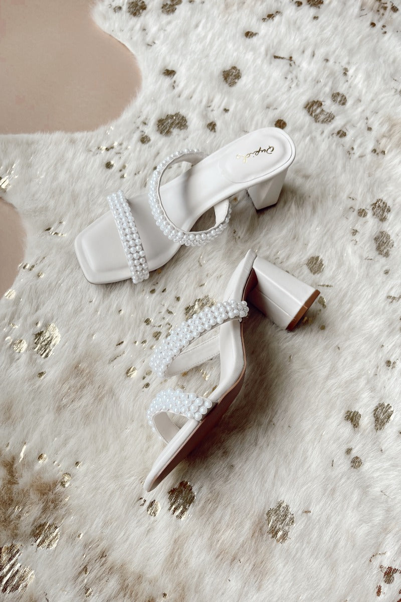 Ariel view of the Kerstin Pearl Heels which features a block heel, pearl detail straps and square toe.