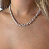 Front view of model wearing the Half And Half Necklace in Silver which features half of a silver chain link with half of a silver braided link.